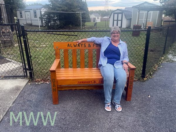 Sue sitting on her bench.